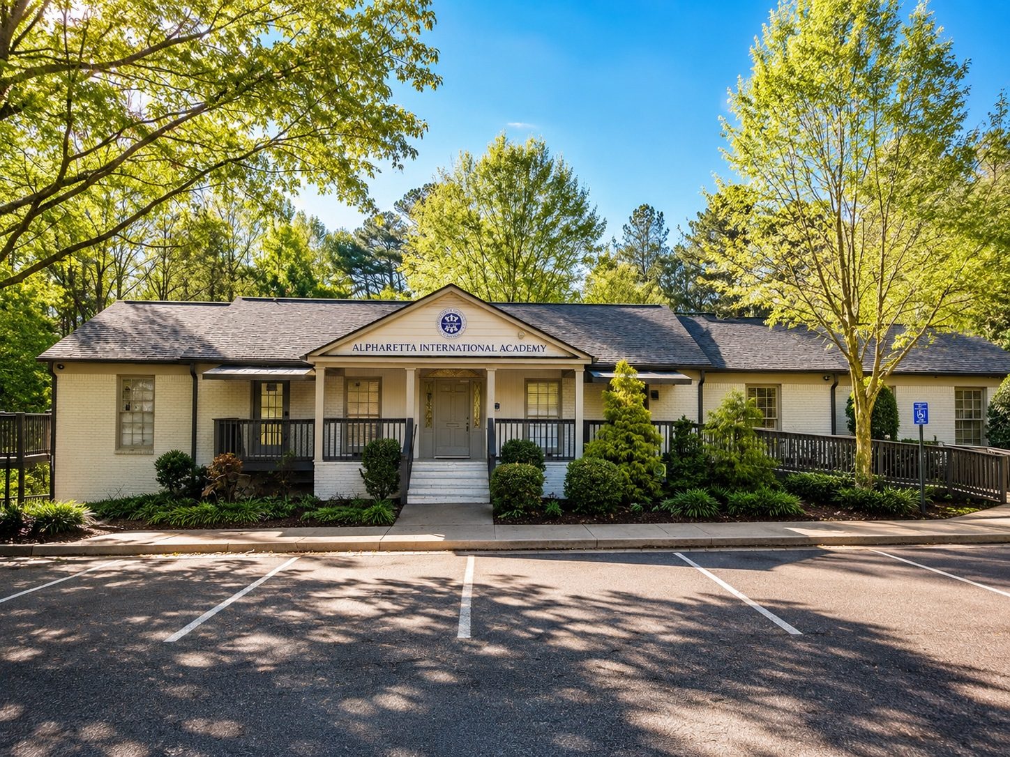 The Alpharetta International Academy campus building, surrounded by trees