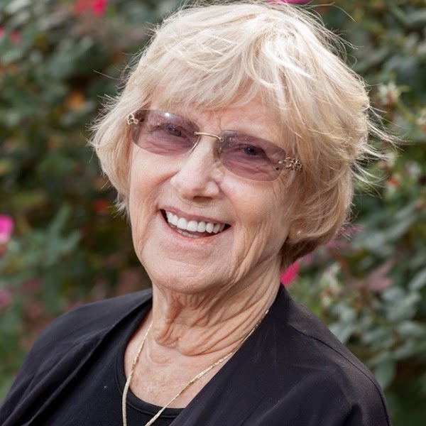 Dixie Oliver, founder of Alpharetta International Academy, smiling outdoors